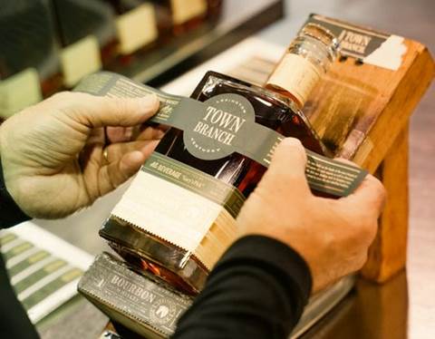 Town Branch whiskey being hand bottled